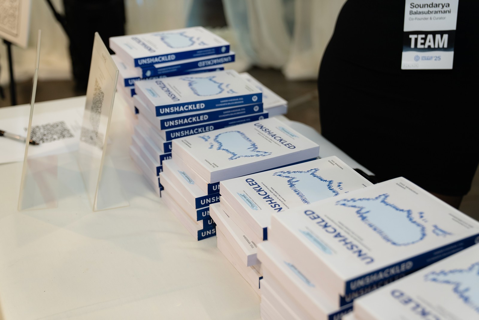 Stacks of Unshackled books at the Summit